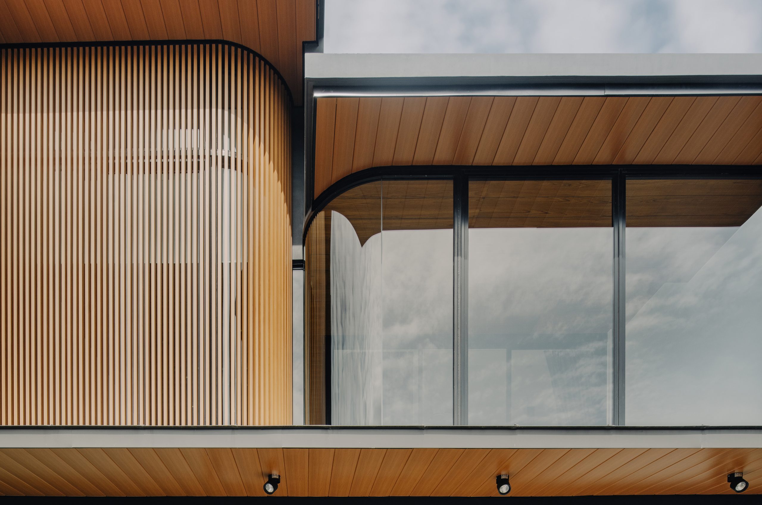 The curved facade of Movement House by Genome Architects.